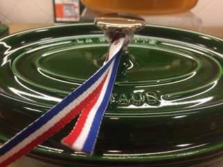 Basil green cocotte made by Stuab (close up picture with French ribbon around the brass knob