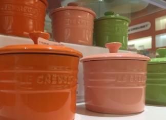 Cute Le Creuset storage dishes. (In the picture two rows of Le Creuset storage dishes are on display. The colours displayed from left to right are: orange, pink and green). What are the benefits of ceramic cookware? With so many reasons it's hard to know where to start. Come to Boonie Hicks to learn more.