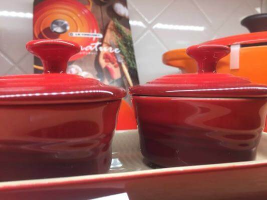 Le Creuset ceramic cookware. (Picture of two red mini ceramic cocottes).