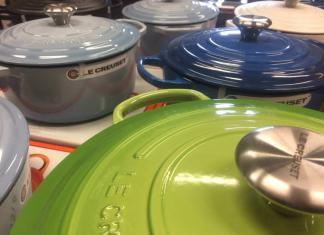 Why is Le Creuset cookware so expensive? (In the picture of different Le Creuset ovens on a table).