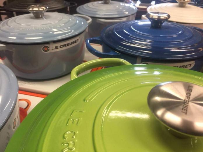 Why is Le Creuset cookware so expensive? (In the picture of different Le Creuset ovens on a table).