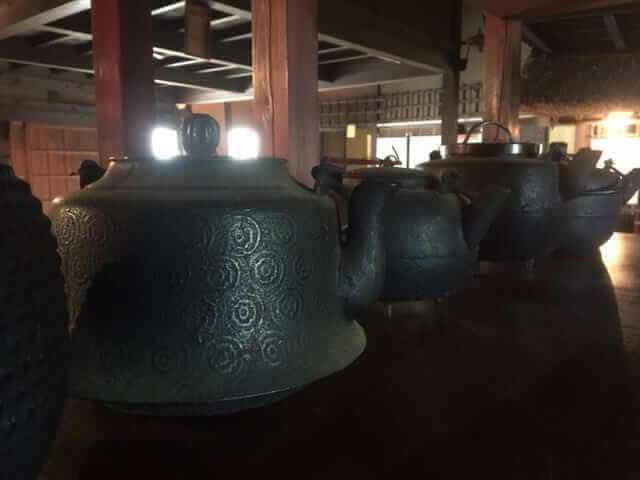 Old Japanese teapots on a bench. These teapots are hundreds of years old and look so beautiful .