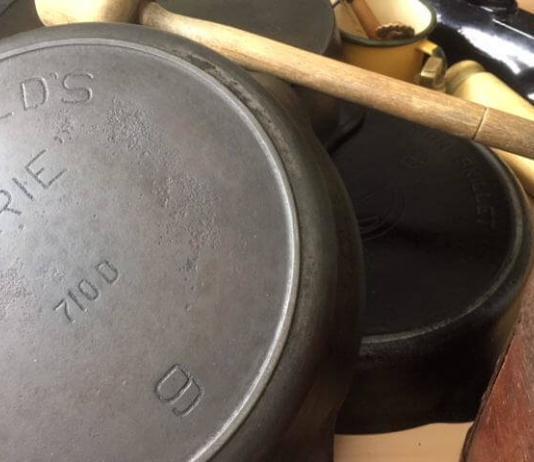 Vintage skillets on a table.