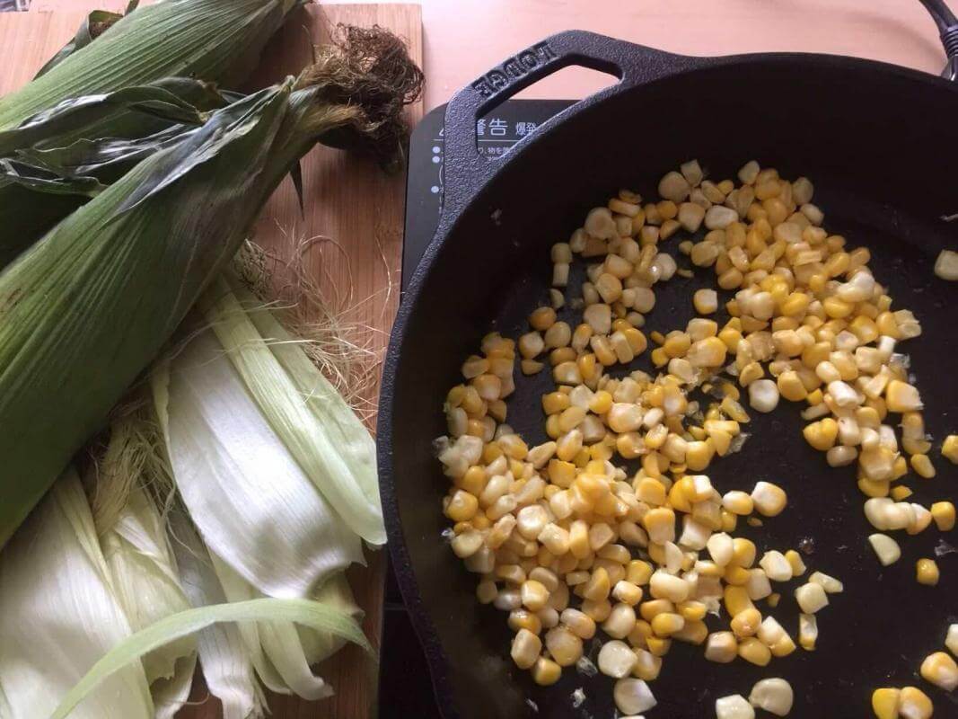 Corn cooking in a Lodge cast-iron skillet