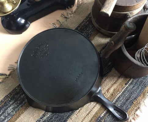 Wagner cast iron skillet on a table. This skillet shows this Wagner Ware Sidney O logo