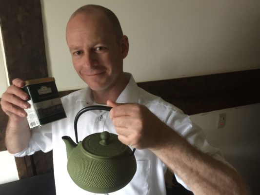 Brett Standeven (Boonie Hicks) holding a Iwachu teapot