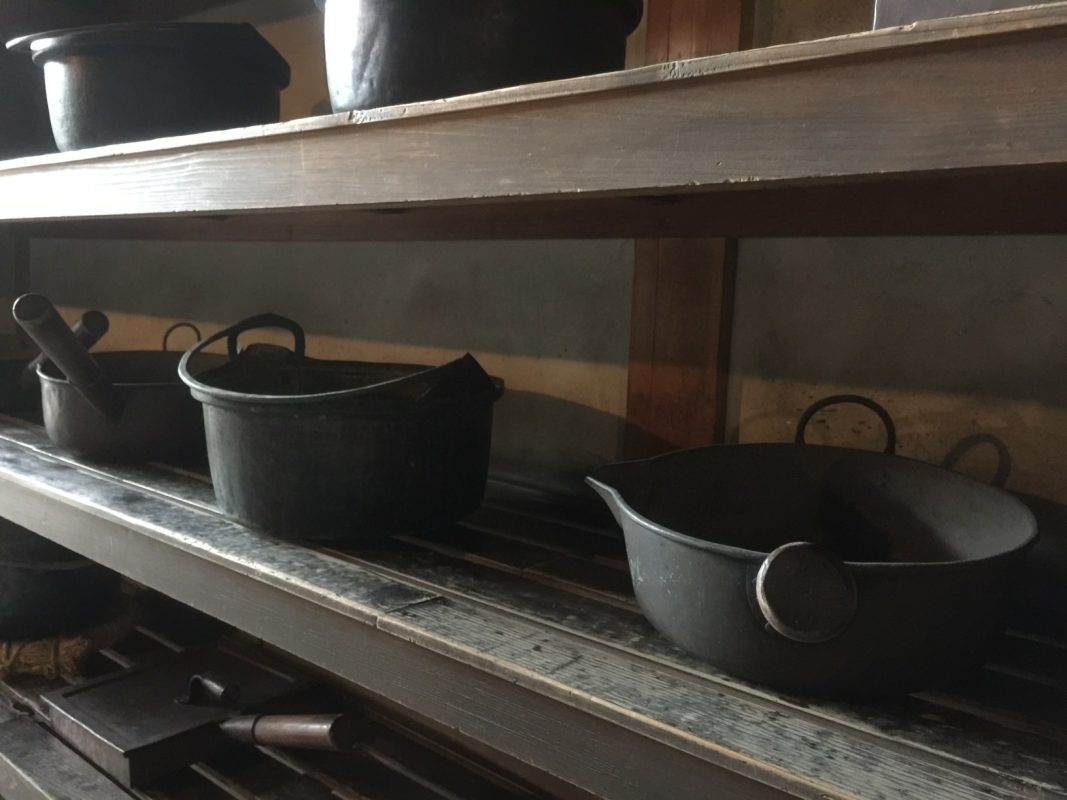 Vintage cast iron pots on display